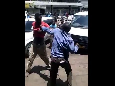 Zimbabwean men fighting for DJ Joey Lion mixtape cd