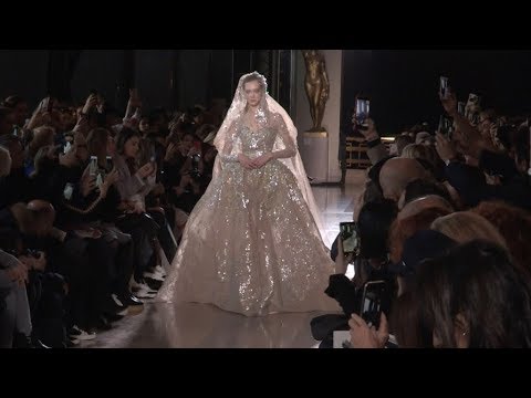 Models and designer on the runway for the Elie Saab HC Fashion Show