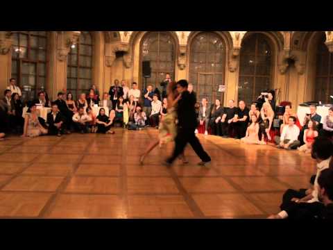  Carlos Espinoza  and  Noelia Hurtado Pitruzzella  are  dancing  to  the  tango  "  Andrajos  "  by  Rodolfo Biagi  at  TangoAmadeus  in  2012