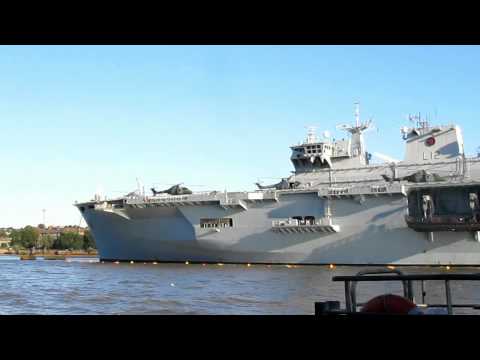 Sailing past The Cutty Sark and HMS Ocean on the River Thames London July 2012 on the Thames Clipper
