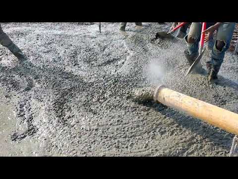 concrete pump at work. Impulse Builders Construction