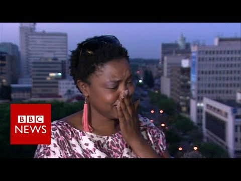 Mugabe resigns: activist breaks down in tears of Joy  – BBC News