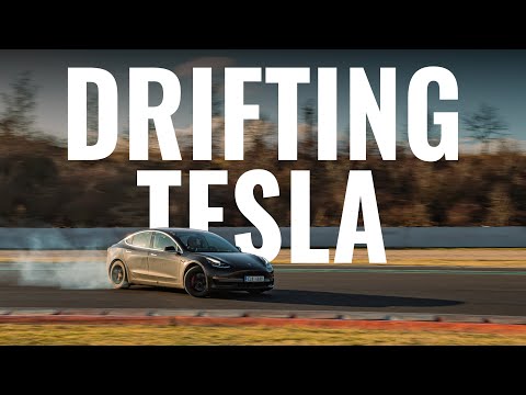 Tesla with KW suspension drifting on a racetrack