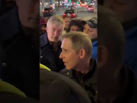 Alec Baldwin argues with protesters, escorted away by police Shorts