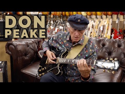 Don Peake playing guitar at Norman's Rare Guitars