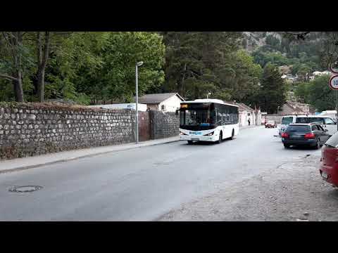 Blue line Isuzu citybus riding through Kotor