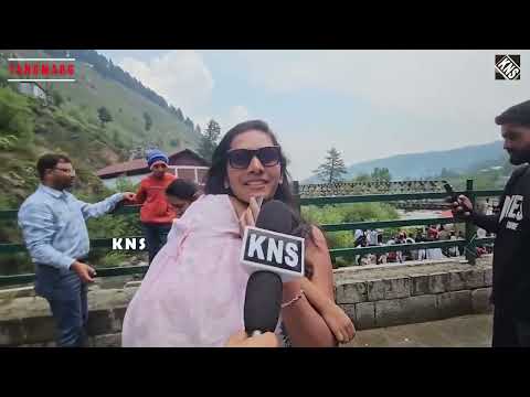 Tourists relish cool weather and scenic views near Drang Waterfall in Tangmarg.  watch report by Correspondent Aaqib Khan