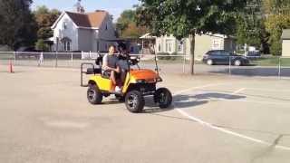 preview picture of video 'Lexington High sophomore Danyelle Fetherlin drives cart with texting helmet'