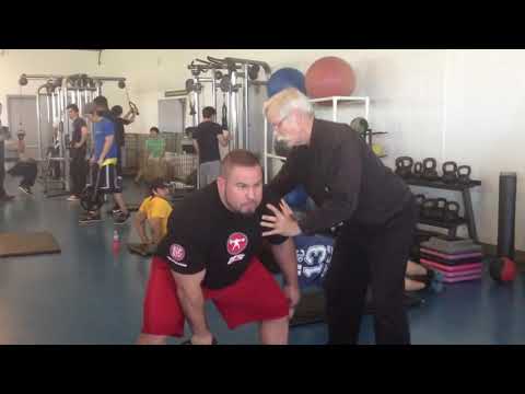 2013 Rehab: Dr. Stuart McGill with Brian Carroll demonstrating 1-arm KB swing for back rehab