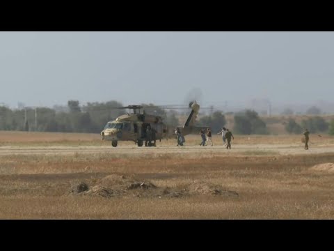 Helicopter carrying mother of US-Israeli hostage lands at army base where he is due to arrive | AFP
