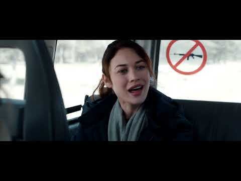 A Perfect Day official trailer frame — aid workers in a muddy Balkan landscape