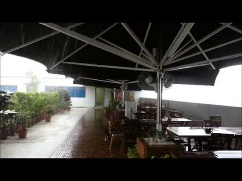 Francia® Jumbo Center Post Parasols in Heavy Rain