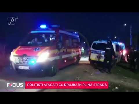 Polițiști atacați cu drujba în plină stradă