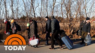 Ukrainians Flee To Poland, Families Face Long Journey To Cross Border