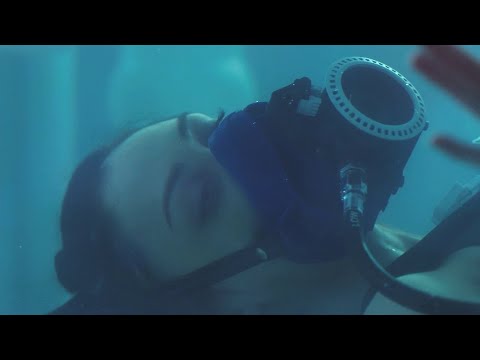 Women with oxygen mask in ice water!