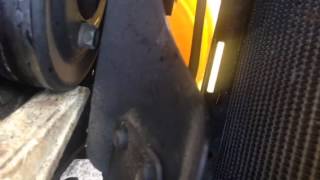 Hold pulley from turning to break bolts loose