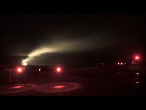 POTA freight train in night fog passes a country level crossing - Australian railroad crossing