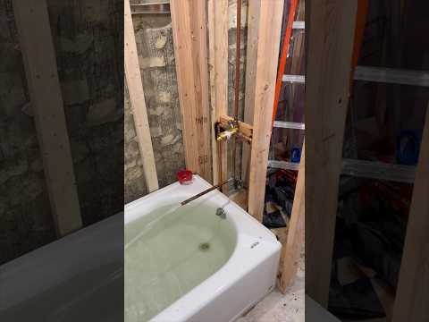 Installing a bathtub and shower body #renovation