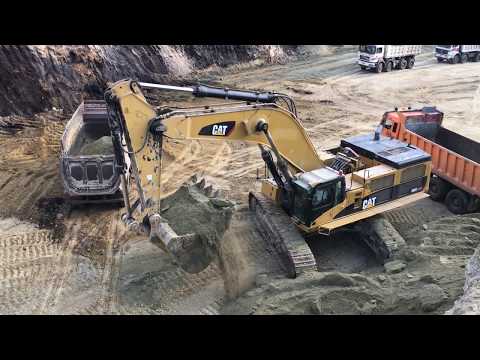 Caterpillar 385C Excavator Loading Trucks