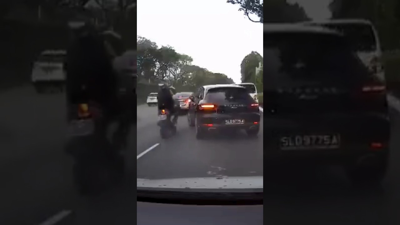 Motorcycle collides with Porsche on AYE, driver opens door leading to second crash