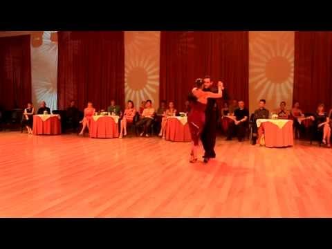  Fausto Carpino  and  Stephanie Fesneau  are  dancing  to  a  tango  at  Kiev International Tango Festival  in  2014
