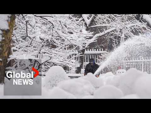 NYC buried in snow after "once in a lifetime storm" brings whiteout conditions