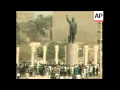 4 3 FILE Iraqis And US Troops Topple Statue Of Saddam Hussein