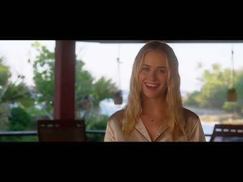 Trailer moment: beachside resort at dusk with party lights