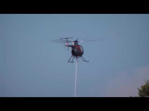 Awesome Helicopter air saw trimming trees - Helicopter trimming trees by high tensions lin