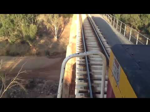 Australian Trains 4 - Qr national 4714 crosses the river bridge at Eradu