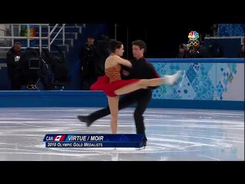 Tessa Virtue and Scott Moir kiss during Sochi 2014 FD warmup