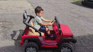 Owen rides the Jeep