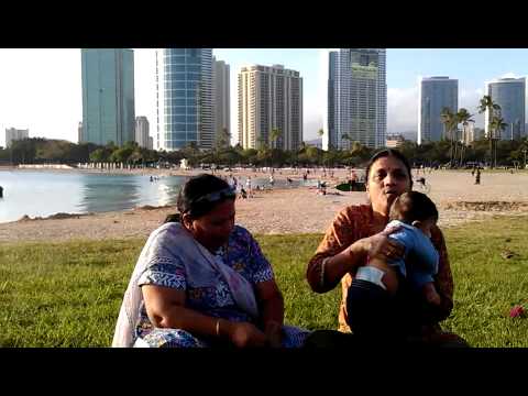 Neev playing at beach with nanis