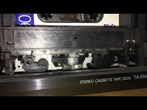 Auto reverse vintage technology in slow-motion!  Cassette tape deck in action.