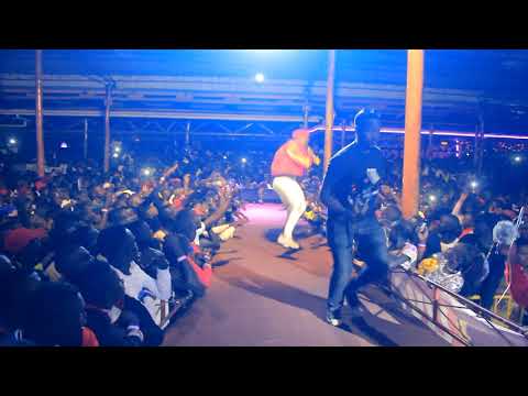 Ykee benda grooving on the audience grabs #byonkola performance in Gulu #