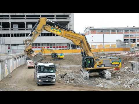 Caterpillar 385C Excavator Loading Trucks
