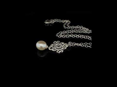 Lace-like silver and pearl Mona Lisa pendant by Brigitte Adolph