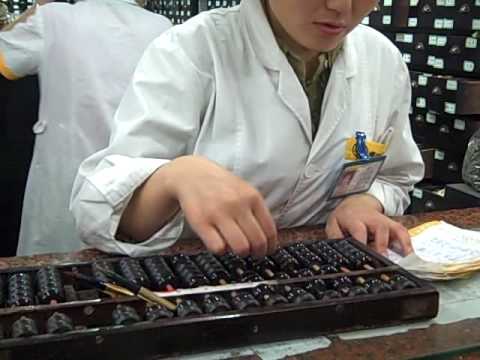 Chinese Pharmacy Clerk Using Abacus