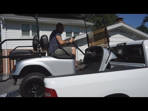 Part of a video titled How to Safely Load a Golf Cart in a Short Bed Truck - YouTube