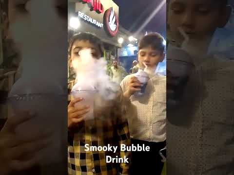 Uzair Enjoying Smoky Bubble drink with Cousin....