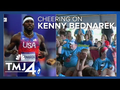 Supporters cheer on Rice Lake's Kenny Bednarek during 200m track final