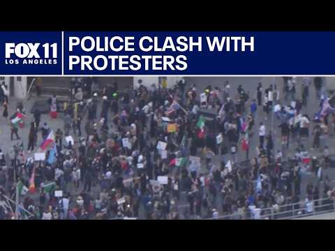 Police clash with anti-ICE protesters in downtown LA