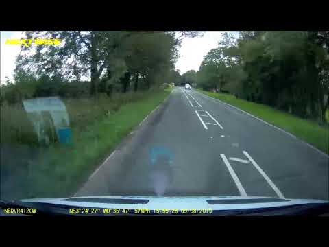 Police investigate footage of overtaking sports car driver who almost causes head-on collision