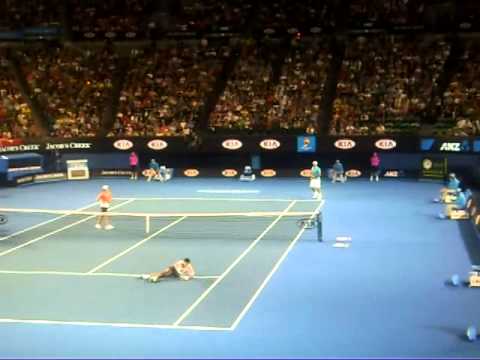 Djokovic sits down during Nadal Federer rally