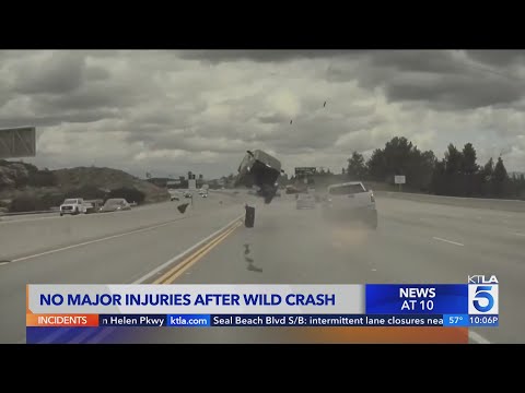 Car launched into air by runaway tire