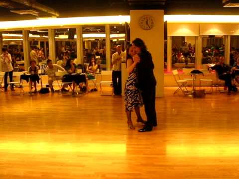  Milena Plebs  and  David Alejandro Palo  are  dancing  to  a  tango