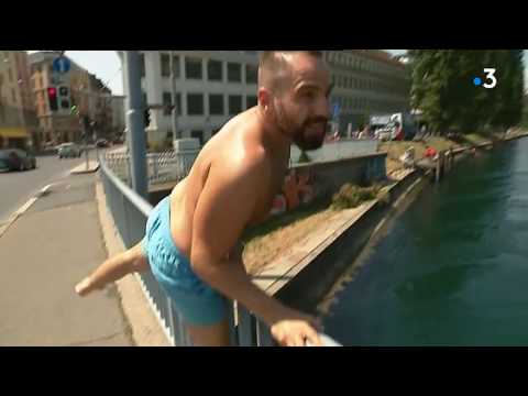 A Genève, les baigneurs se laissent dériver dans l'eau cristalline du Rhône