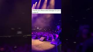 Akon and Savage holding up Samoan flag