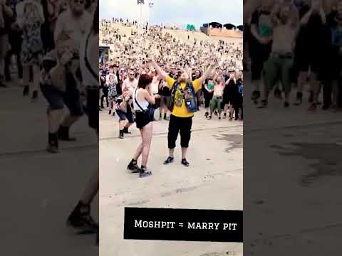 Newly engaged couple swallowed by a "wall of death" #metal #proposal #copenhell