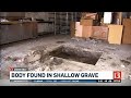 Body discovered in shallow grave